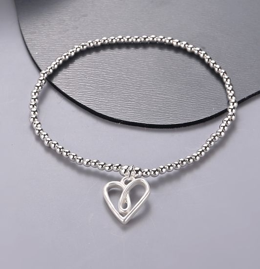 twisted-heart-pendant-on-stretchy-bracelet-silver